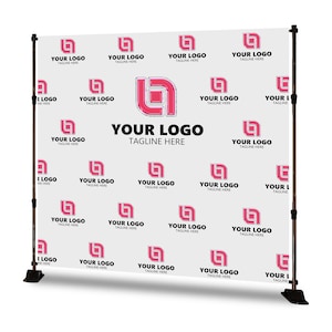 May include: A white backdrop with a repeating pink logo pattern and the text "YOUR LOGO TAGLINE HERE." The backdrop is supported by a black adjustable stand, suitable for events and presentations.