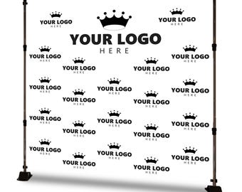 May include: A white backdrop with a repeating crown pattern and the text "YOUR LOGO HERE." The backdrop is supported by two adjustable poles with black bases, designed for events and branding.