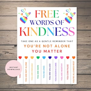 May include: A white printable sign with the words "FREE WORDS OF KINDNESS" in rainbow colors. The sign includes the phrases "YOU'RE NOT ALONE" and "YOU MATTER". Below are phrases like "YOU ARE ENOUGH" and "YOU ARE WORTHY".