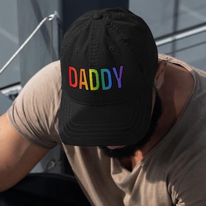 Rainbow Daddy Hat – Funny Pride Cap – LGBTQ+ Daddy Baseball Hat – Bold Embroidered Rainbow Lettering Distressed Dad Hat