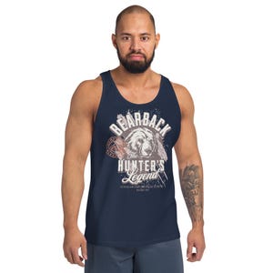 May include: Navy blue tank top with a distressed graphic featuring a bear illustration and the text "BEARBACK The HUNTER'S Legend". The design includes a circular emblem and additional text at the bottom. The tank top is sleeveless.