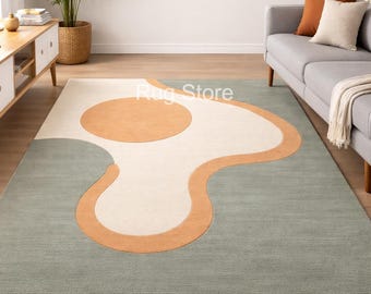 Tapete moderno abstrato feito à mão em lã, estilo escandinavo orgânico, verde sálvia e terracota.