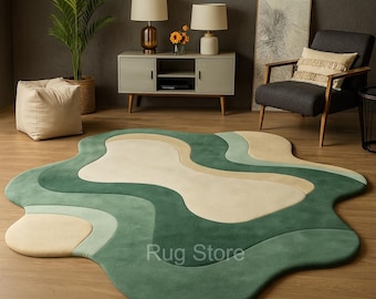 Tapete tufado à mão em tons de verde e bege com formato orgânico – Ideal para interiores minimalistas.