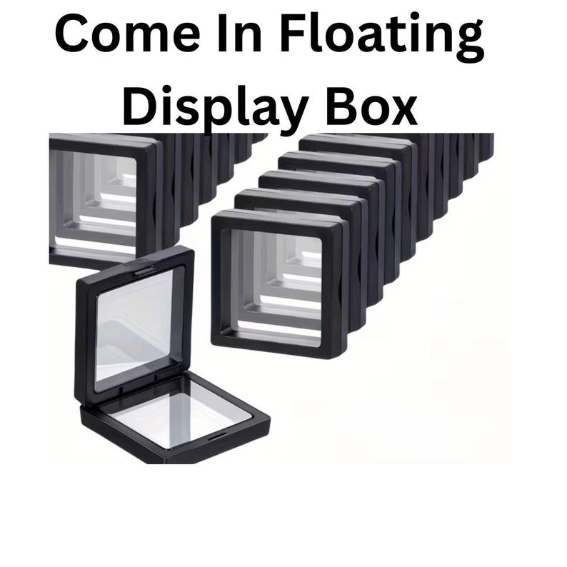 May include: Black floating display boxes with clear windows. The boxes are arranged in a row, with one open to display the interior. The text "Come In Floating Display Box" is at the top.