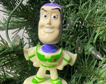 Toy Story "Buzz Lightyear"-pop kerstornament Wiebelend hoofd 3,5" hoog