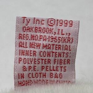 May include: A white fabric tag with red text that reads "Ty Inc &copy;1999 Ork Brook, IL. Reg. No. PA-1955(KAI) All New Material Inner Contents: Polyester Fiber BPE Pellets In Cloth Bag"