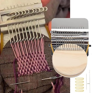 May include: A weaving loom with a partially woven piece of fabric in shades of pink and purple. The loom is made of metal and wood, with a series of hooks and needles. Additional tools include a needle and gold-colored safety pins.