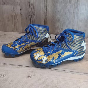Botas de fútbol para niños Under Armour talla 3 azul y dorado