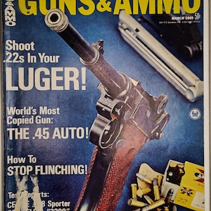 May include: Vintage March 1969 issue of Guns & Ammo magazine. The cover features a Luger pistol with the headline "Shoot .22s In Your LUGER!" and a .45 Auto. The magazine is set against a blue background.