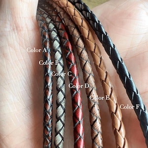 May include: Six braided leather cords arranged side by side, labelled Color A through Color F. The cords feature various finishes including dark brown, distressed white, red, distressed tan, light tan, and solid black, each with a woven texture.