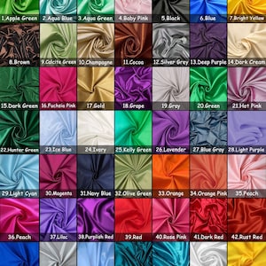 Puede incluir: Una carta de colores que muestra 49 muestras de tela de satén en varios tonos. Los colores van desde verdes y azules hasta rosas, morados y amarillos. Cada muestra está etiquetada con un número y un nombre de color, como "Verde Manzana" y "Azul Real."