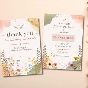 May include: Two rectangular thank you cards with watercolor floral accents in green, yellow, and pink. The left card reads thank you for choosing handmade and Your support helps a dream grow. The right card reads A little gift for next time, Use code: THANKYOU10 for 10% off your next order, and Follow us: @yourshopname.