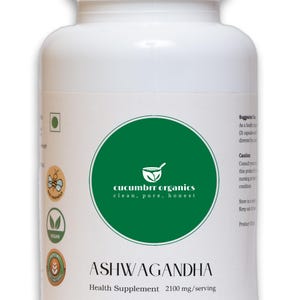 May include: White plastic bottle of Ashwagandha health supplement. The label features a green circle with the text "cucumbrr organics clean, pure, honest" and the word "ASHWAGANDHA". The bottle contains 2100 mg per serving.