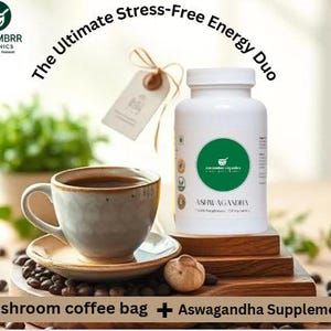 May include: A white bottle of Ashwagandha supplements next to a cup of coffee on a saucer. The image includes the text "The Ultimate Stress-Free Energy Duo" and "Mushroom coffee bag + Aswagandha Supplements".