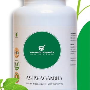 May include: A white plastic bottle of Ashwagandha health supplement. The label features a green circle with the text "cucumbrr organics clean, pure, honest". The text "ASHWAGANDHA Health Supplement 2100 mg/serving" is below the circle. The bottle has a white cap.