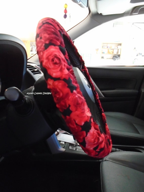 Dark red roses steering wheel cover. Realistic roses on black.