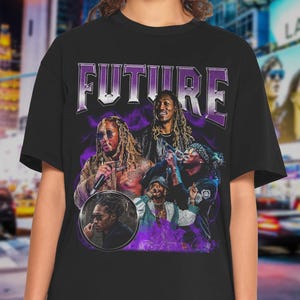 May include: Black t-shirt featuring a graphic of the word "FUTURE" in a purple and silver design. The shirt showcases multiple images of a musician in various poses, with a purple haze effect.