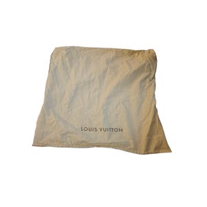 May include: Beige dust bag with the text "LOUIS VUITTON" printed in black. The bag is made of a soft, slightly wrinkled fabric. The bag is designed to protect luxury goods.