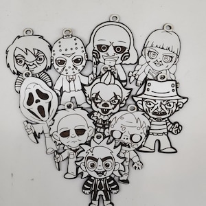 May include: A collection of black and white cartoon character ornaments, including Chucky, Jason Voorhees, and Freddy Krueger. Each ornament has a small hole at the top for hanging. The characters are arranged in a heart shape.