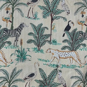 May include: A quilted fabric featuring a repeating jungle pattern on a light beige background. The design includes black and white zebras, spotted leopards, various tropical birds, and green palm trees with small yellow flowers.