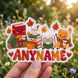 May include: A die-cut sticker featuring a red book with a pumpkin and coffee, a stack of books with a mug, an open book with glasses, and a yellow book with a scarf and coffee. The text ANYNAME appears in large, colorful, bubbly letters.