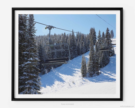 Premium Photo  Empty ski lift covered with frost and snow with mountains  at background