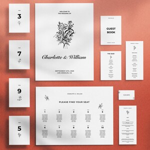May include: A set of wedding stationery in monochrome. Includes table numbers, a welcome sign, guest book, bar menu, dinner menu, place cards, and a seating chart. The design features floral illustrations and the names "Charlotte & William".