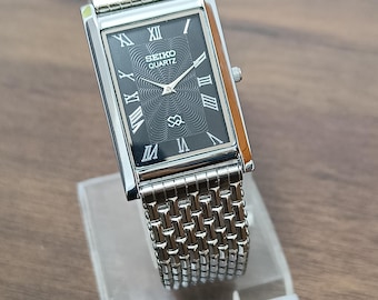 Vintage Seiko Slim Tank Quartz Watch: Stainless Steel Retro Timepiece