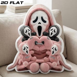 May include: A plush, pink Ghostface-inspired pillow with a white mask and black eye and mouth details. The pillow features the word "Mommy" in a heart shape, with smaller Ghostface plushies labeled "Kevin", "Tom", "Taylor", and "Nancy". The text "2D FLAT" is in the top left corner.