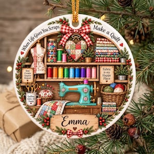 May include: A round ceramic ornament featuring a sewing room scene with a teal sewing machine, spools of thread, a mannequin, and a basket of yarn. The text reads When Life Gives You Scraps Make a Quilt, Sew Create Inspire Repeat, Fabric is my Happy Place, and Emma.