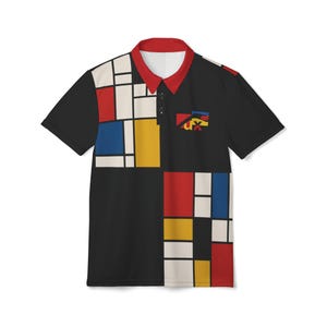 May include: Black polo shirt with a Mondrian-style color block design in red, yellow, blue, and white. The shirt has a red collar and a small pocket with a logo. A modern and artistic apparel item.