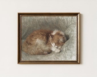May include: A framed painting of a sleeping orange and white cat. The cat is curled up on a gray surface, with its eyes closed. The painting has a vintage aesthetic, with a gold-colored frame.