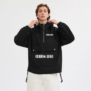 Chaqueta cortavientos con logotipo personalizado, sudadera unisex con capucha, ropa urbana negra, ropa deportiva personalizada para hombre y mujer.