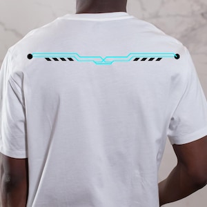 May include: White t-shirt with a neon blue and black graphic design across the upper back. The design features a horizontal line with geometric shapes and dashes. The shirt is made of a soft, comfortable material.