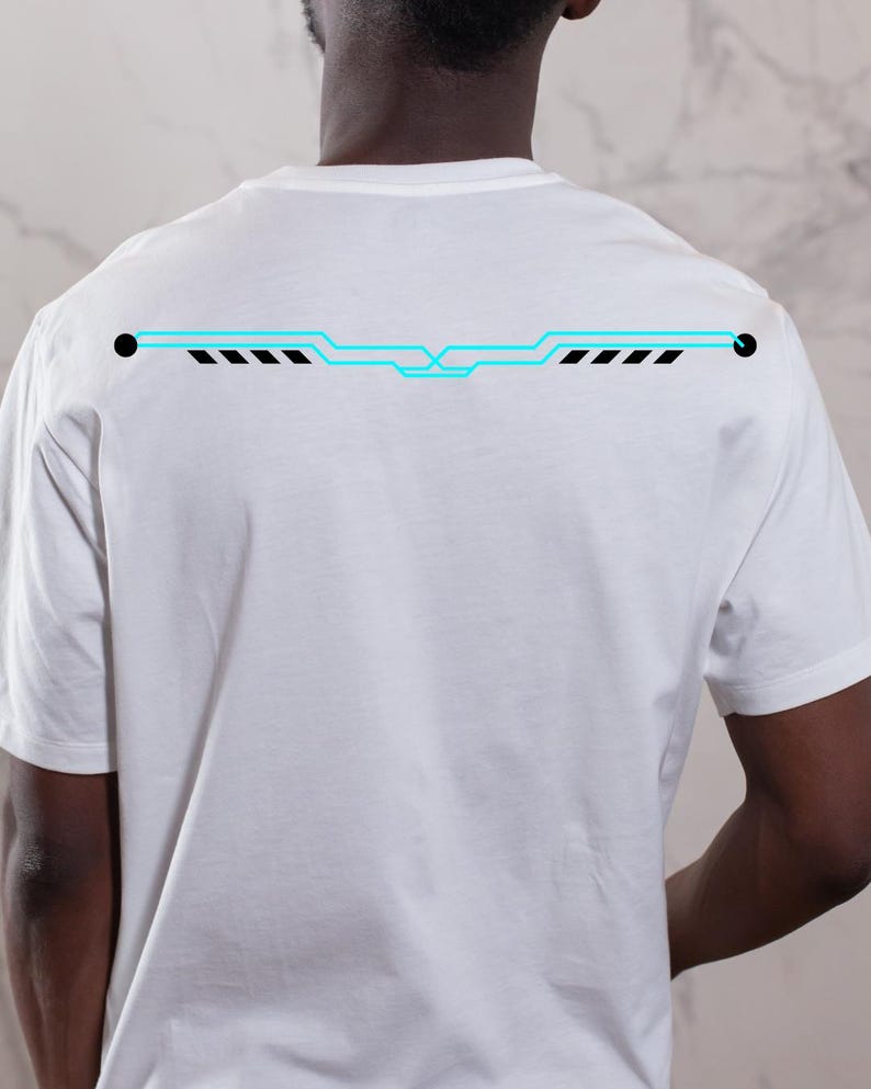 May include: White t-shirt with a neon blue and black graphic design across the upper back. The design features a horizontal line with geometric shapes and dashes. The shirt is made of a soft, comfortable material.