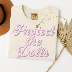 Feminist &#39;Protect the Dolls&#39; T-Shirt – Soft Bella Canvas Tee for Gender Equality, Human Rights, Trans Rights Gift, and Transgender Pride