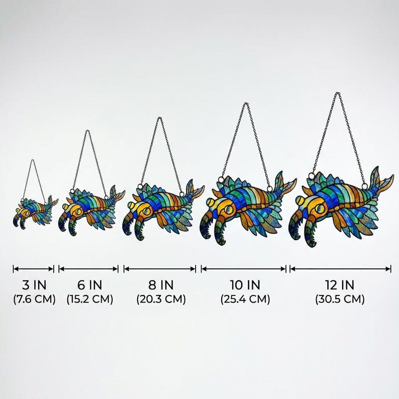 May include: A collection of stained glass sea creature ornaments, ranging in size from 7.6 cm to 30.5 cm. The ornaments display a vibrant array of colours, including blue, green, yellow, and orange, and are hung by a chain.