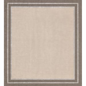 May include: A square rug with a neutral color palette. The central field is a light beige, framed by a border of darker brown and a thin silver accent. The rug's design is simple and elegant, suitable for various interior styles.