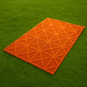 モダンなオレンジ色の幾何学模様のラグ - 大胆な室内アクセントラグ