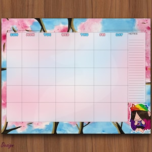 Puede incluir: Calendario mensual con un diseño floral en acuarela en rosa y azul. La cuadrícula del calendario es blanca con los días de la semana en la parte superior. Un personaje de dibujos animados con pelo arcoíris y un logo de zorro están en las esquinas.