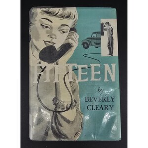 May include: Vintage book cover for "Fifteen" by Beverly Cleary. The cover features a woman on the phone, a car, and a man. The title "Fifteen" is prominently displayed in white, with the author's name below.