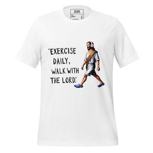 May include: White t-shirt featuring the text "EXERCISE DAILY, WALK WITH THE LORD." The graphic shows a person wearing headphones and sandals. The person is walking. A small logo is near the neckline.