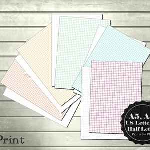 May include: A set of printable grid paper in various colors and sizes, including A5, A4, US Letter, and Half Letter. The papers are arranged in a fan shape on a woodgrain background. The text "toPrint" is visible in the lower left corner. The text "A5, A4, US Letter, & Half Letter Printable PDF" is visible in the lower right corner.