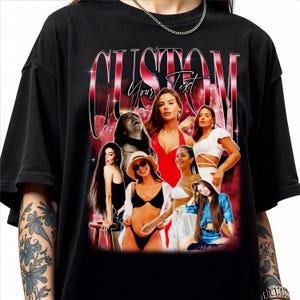 May include: Black oversized t-shirt featuring a graphic with the word "CUSTOM" in a red and white retro font. The graphic includes a collage of women in various outfits. The words "Your Text" are also visible.