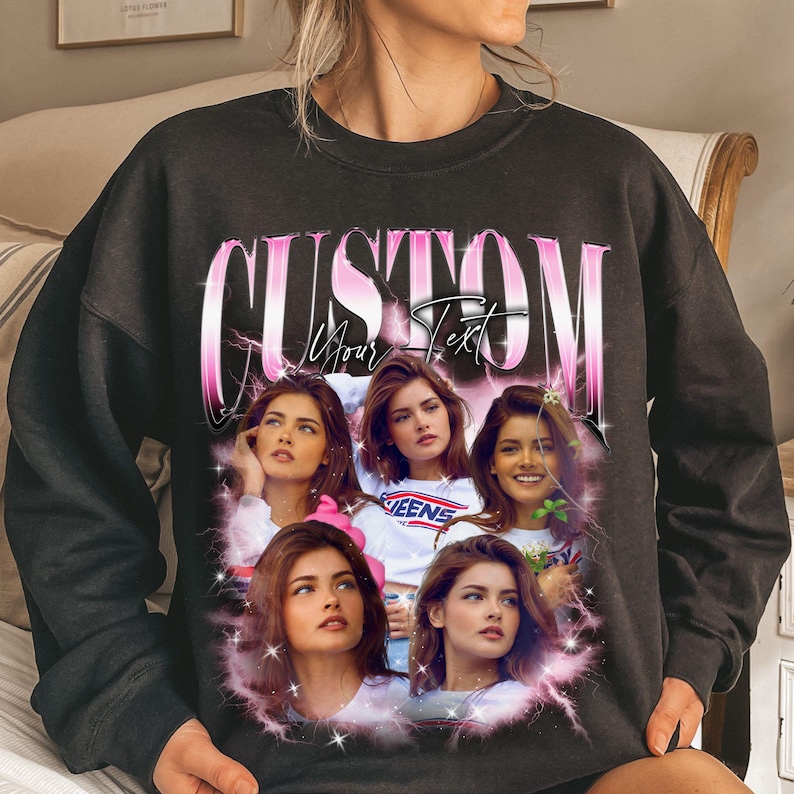 May include: Black sweatshirt with a custom design. The design features a collage of images of a person, with the word "CUSTOM" in pink and white text above the images. The words "Your Text" are also visible.