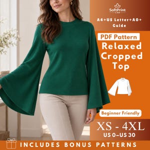 May include: A dark green long-sleeved top with wide bell sleeves and a crew neckline. The image includes text: SoftPrint Lab, A4+US Letter+A0+ Guide, PDF Pattern Relaxed Cropped Top, Beginner Friendly, XS - 4XL, US 0-US 30, INCLUDES BONUS PATTERNS.