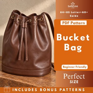 May include: A brown leather bucket bag with a drawstring closure and gold-tone metal eyelets. The image includes text: SoftPrint LAB, A4+US Letter+A0+ Guide, PDF Pattern, Bucket Bag, Beginner Friendly, Perfect SIZE, INCLUDES BONUS PATTERNS.