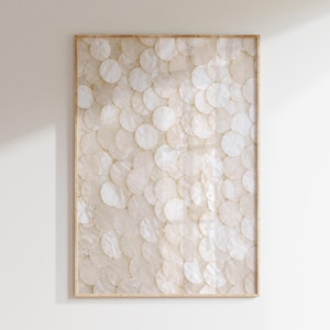 May include: A rectangular wall art piece featuring a layered pattern of translucent, circular, off-white discs arranged in an overlapping, scale-like formation. The artwork is encased in a thin, light-toned wooden frame with a clean, simple edge.