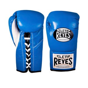 May include: A pair of blue boxing gloves with white laces and the "CLETO REYES" logo. The gloves are made of leather and have a professional design. The gloves are designed for boxing and other combat sports.