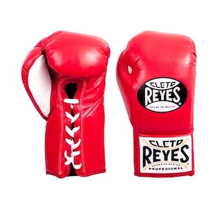 May include: Pair of red leather boxing gloves with white laces. The gloves have the brand name "CLETO REYES" printed on the wrist area and the top of the glove. The gloves are made in Mexico.